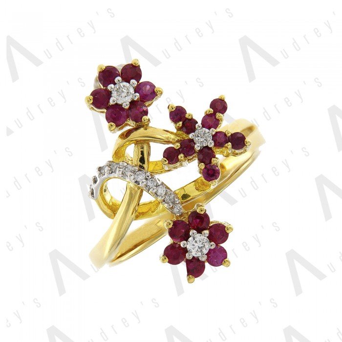 18 KARAT DIAMOND AND GEMSTONE RING