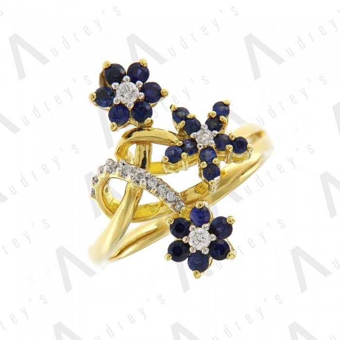 18 KARAT DIAMOND AND GEMSTONE RING