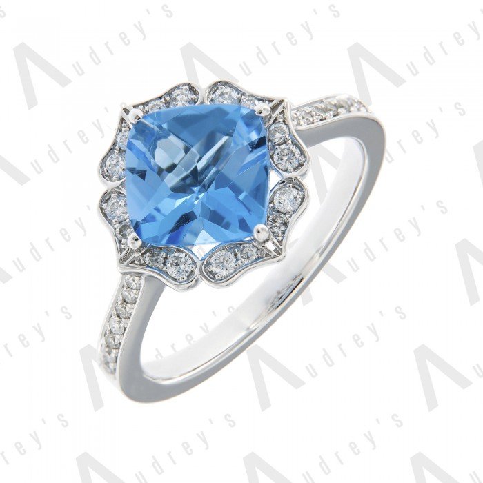 9 KARAT DIAMOND AND GEMSTONE RING