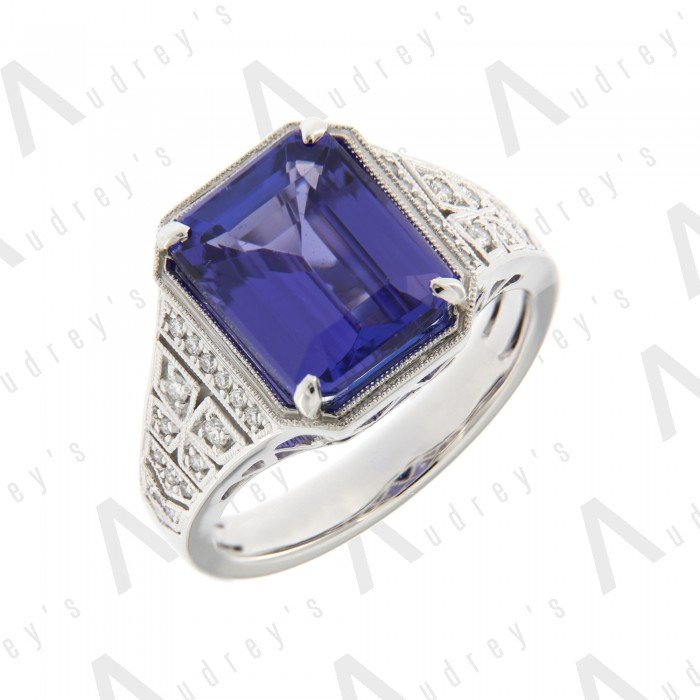 18 KARAT DIAMOND AND GEMSTONE RING