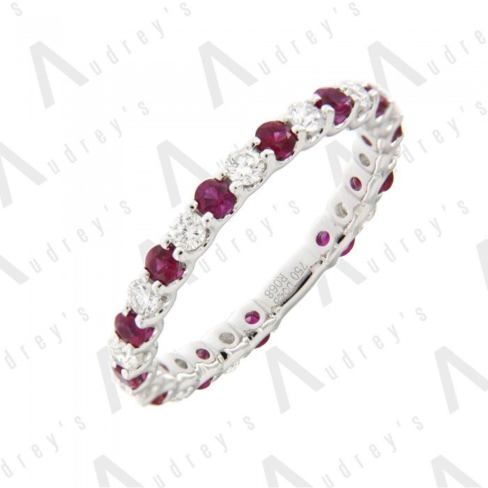 18 KARAT DIAMOND AND GEMSTONE RING BAND