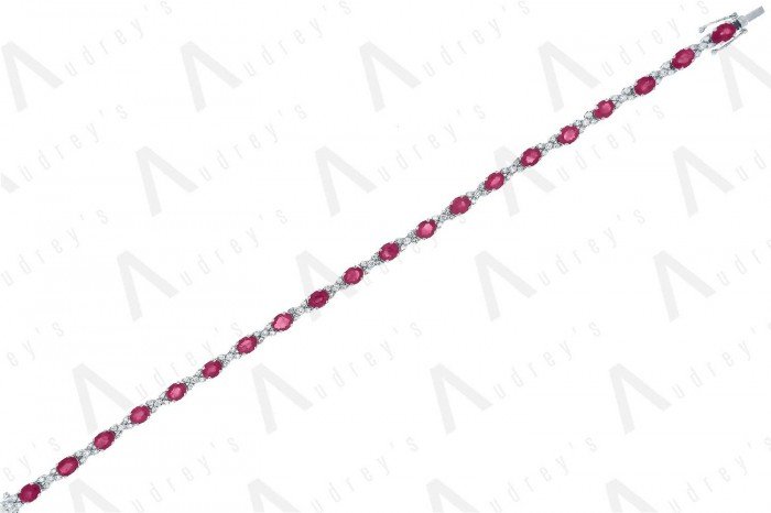 18 KARAT DIAMOND AND GEMSTONE BRACELET