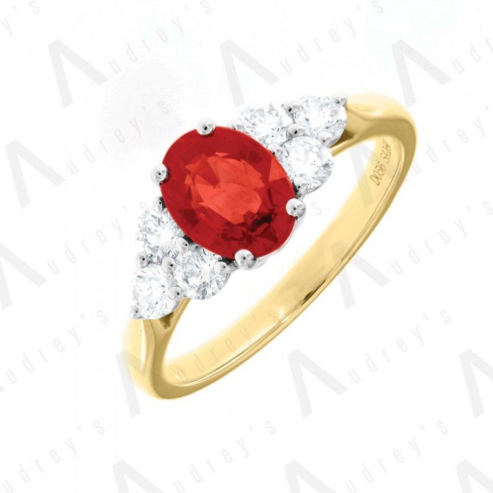18 KARAT DIAMOND AND GEMSTONE RING