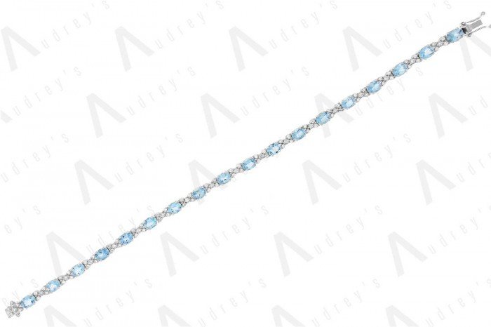 18 KARAT DIAMOND AND GEMSTONE BRACELET