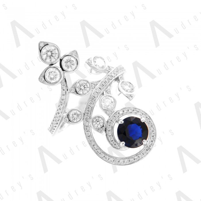 18 KARAT DIAMOND AND GEMSTONE RING