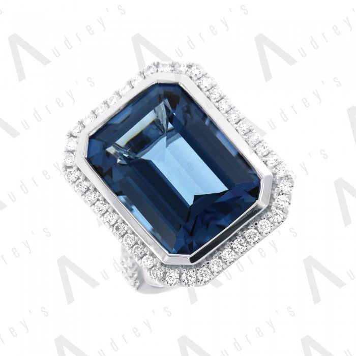 18 KARAT DIAMOND AND GEMSTONE RING