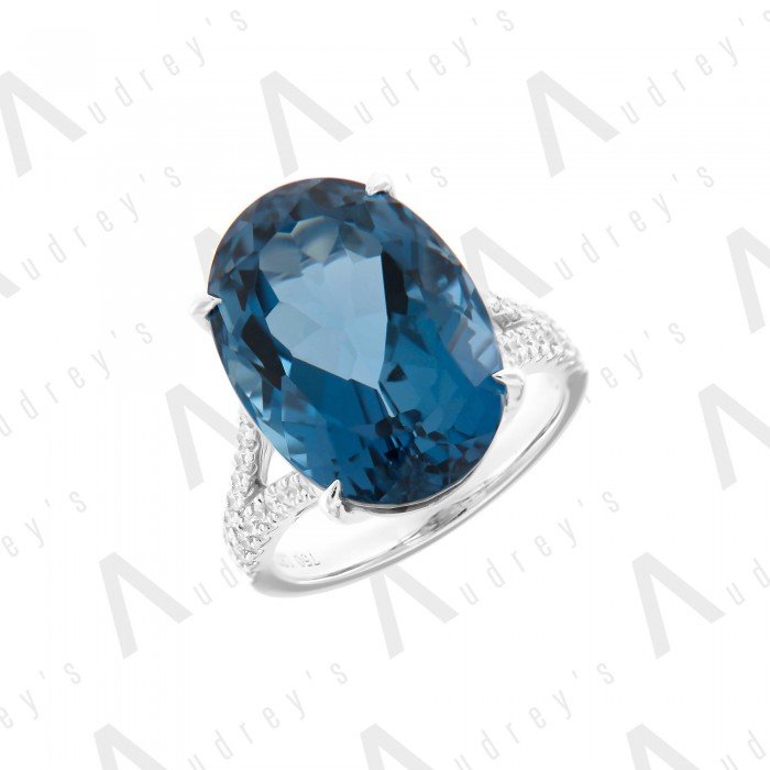 18 KARAT DIAMOND AND GEMSTONE RING