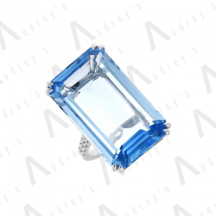 18 KARAT DIAMOND AND GEMSTONE RING