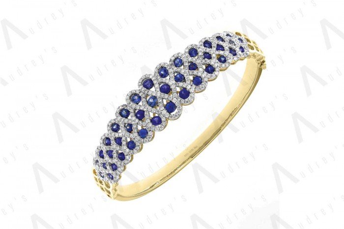 18 KARAT DIAMOND AND GEMSTONE BANGLE