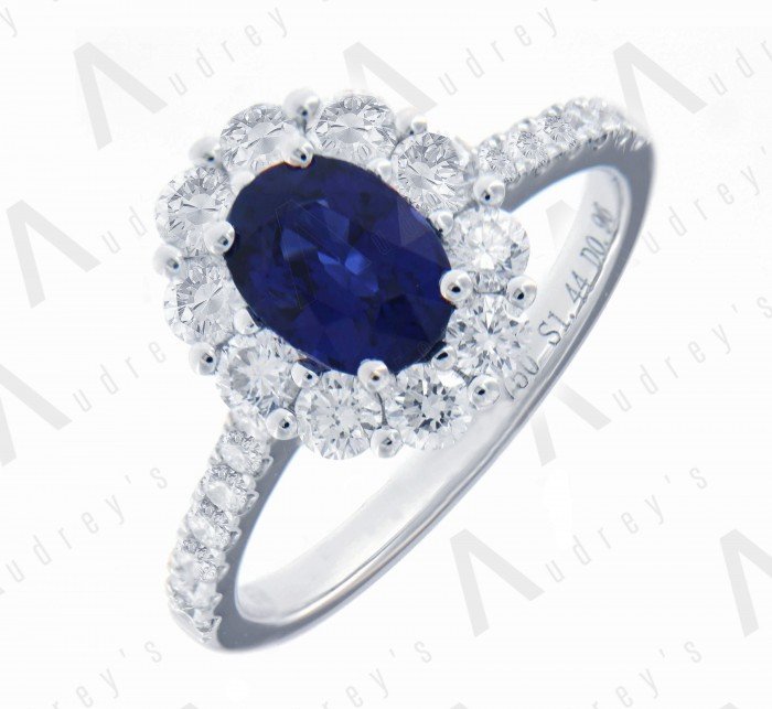 18 KARAT DIAMOND AND GEMSTONE RING
