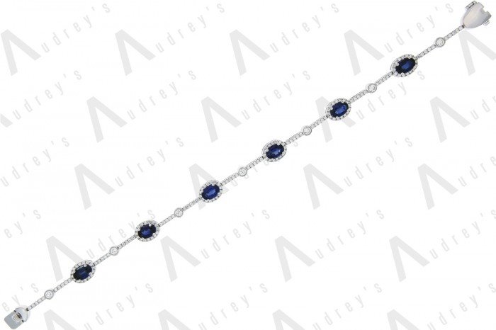 18 KARAT DIAMOND AND GEMSTONE BRACELET