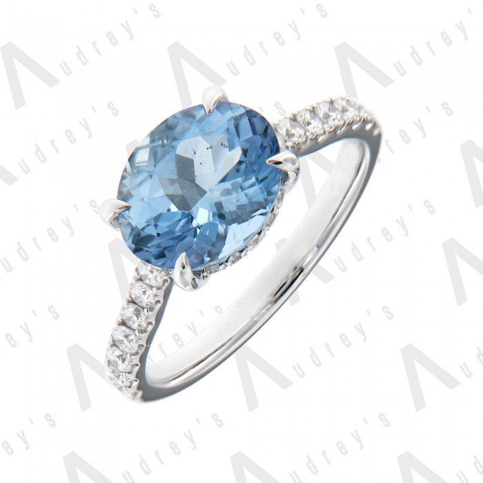 18 KARAT DIAMOND AND OVAL GEMSTONE RING 