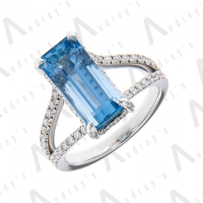 18 KARAT DIAMOND AND GEMSTONE RING