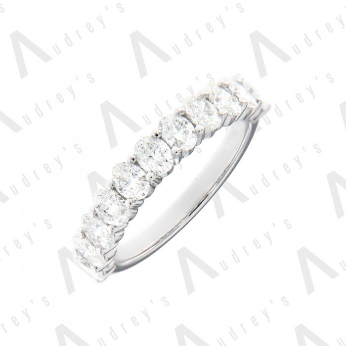 18 KARAT OVAL DIAMOND WEDDING BAND