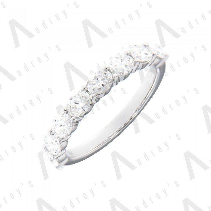 18 KARAT OVAL DIAMOND WEDDING BAND