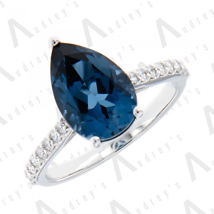 18 KARAT DIAMOND AND GEMSTONE RING