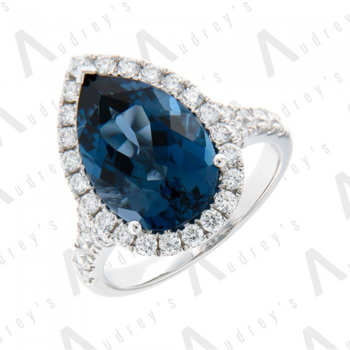 18 KARAT DIAMOND AND GEMSTONE RING