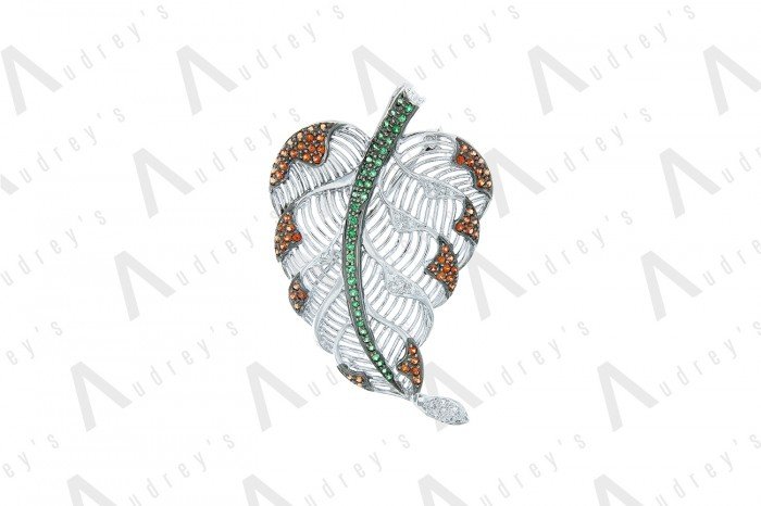 18 KARAT DIAMOND AND GEMSTONE BROOCH