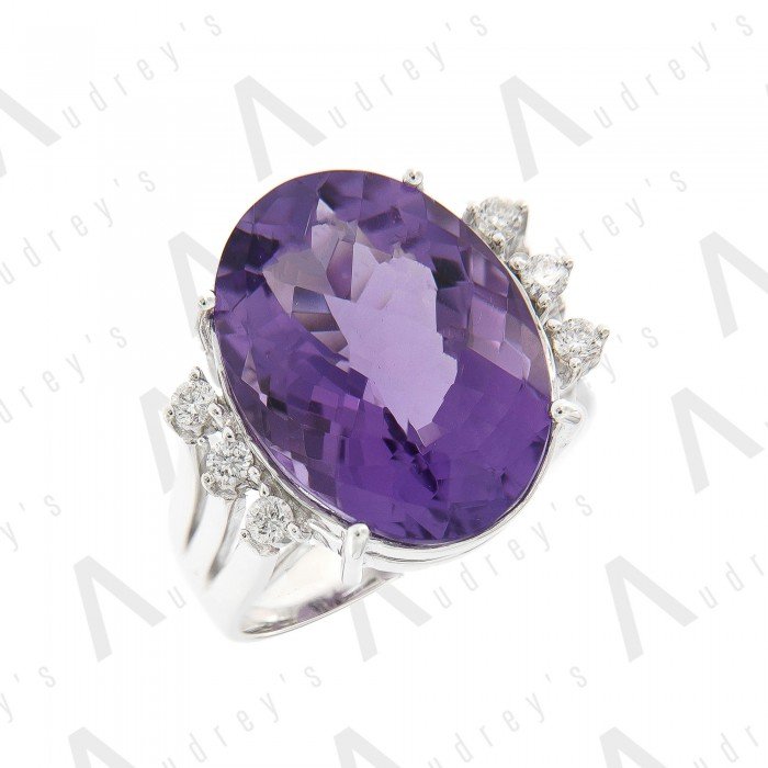 18 KARAT DIAMOND AND GEMSTONE RING