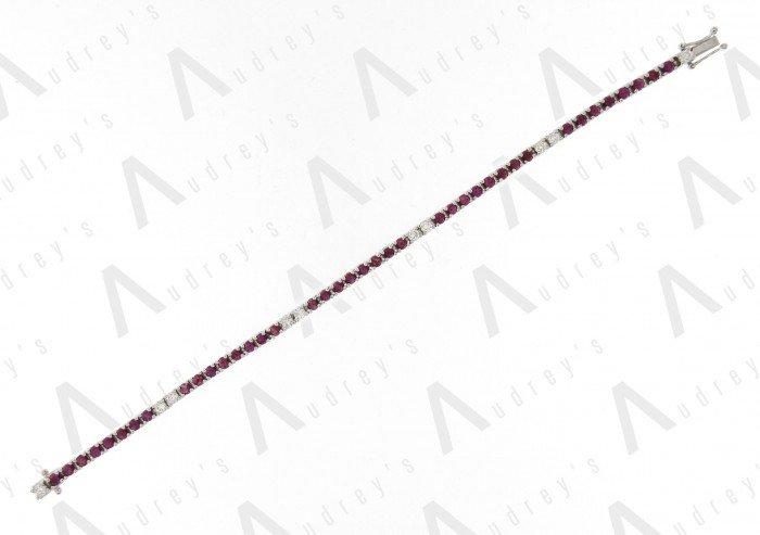 18 KARAT DIAMOND AND GEMSTONE BRACELET