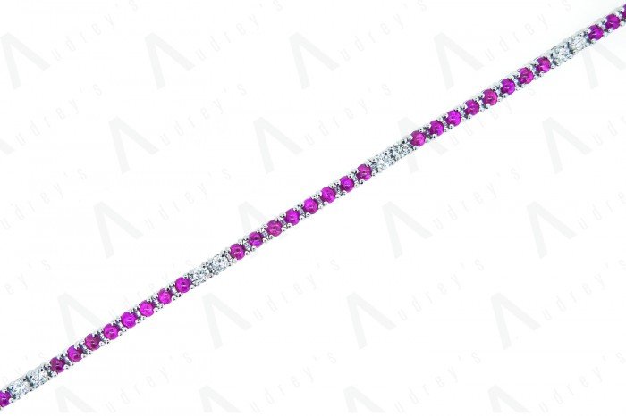 18 KARAT DIAMOND AND COLOR STONE BRACELET