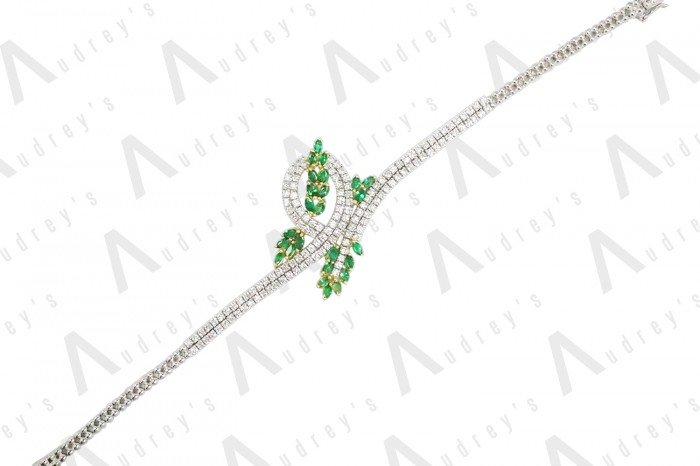 18 KARAT DIAMOND AND GEMSTONE BRACELET