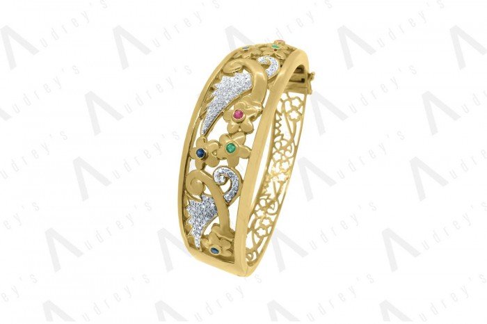 18 KARAT DIAMOND AND GEMSTONE BRACELET