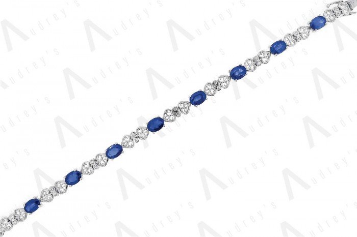 18 KARAT DIAMOND AND GEMSTONE BRACELET