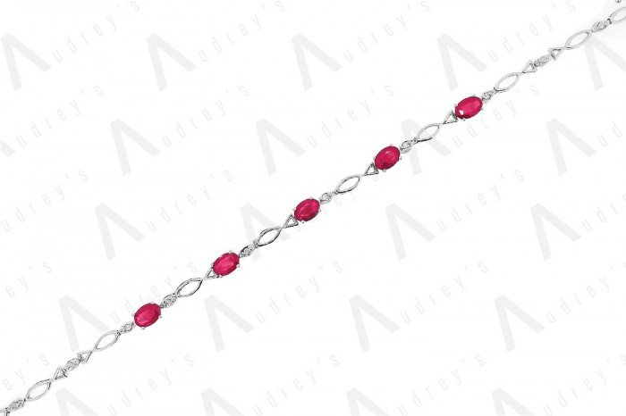 18 KARAT DIAMOND AND GEMSTONE BRACELET