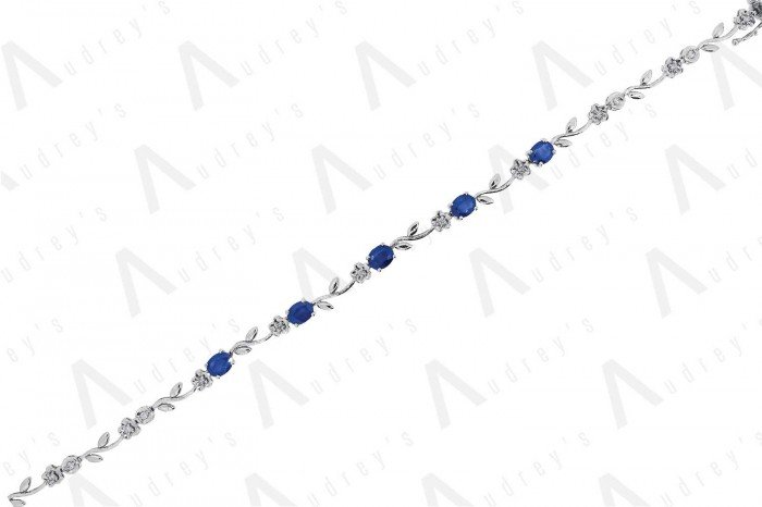 9 KARAT DIAMOND AND GEMSTONE BRACELET
