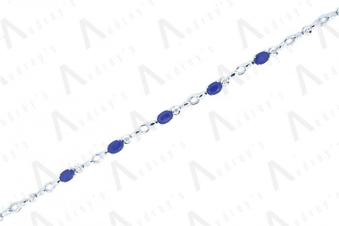 18 KARAT DIAMOND AND GEMSTONE BRACELET
