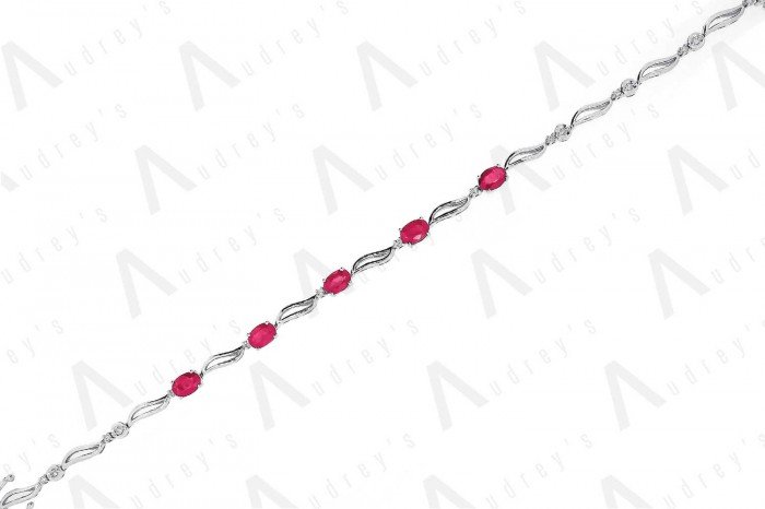 9 KARAT DIAMOND AND GEMSTONE BRACELET