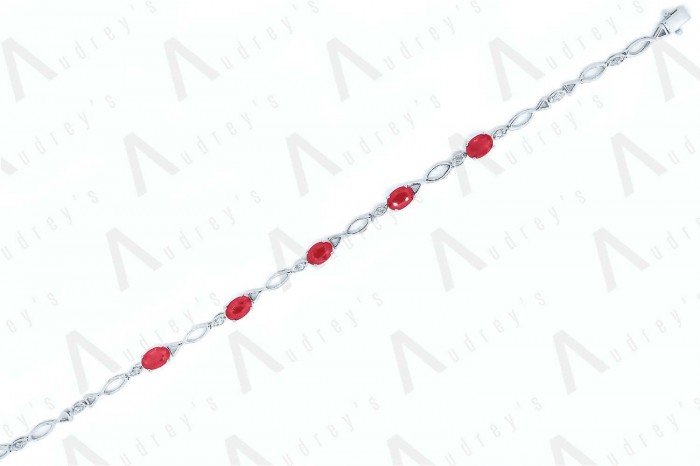 18 KARAT DIAMOND AND GEMSTONE BRACELET